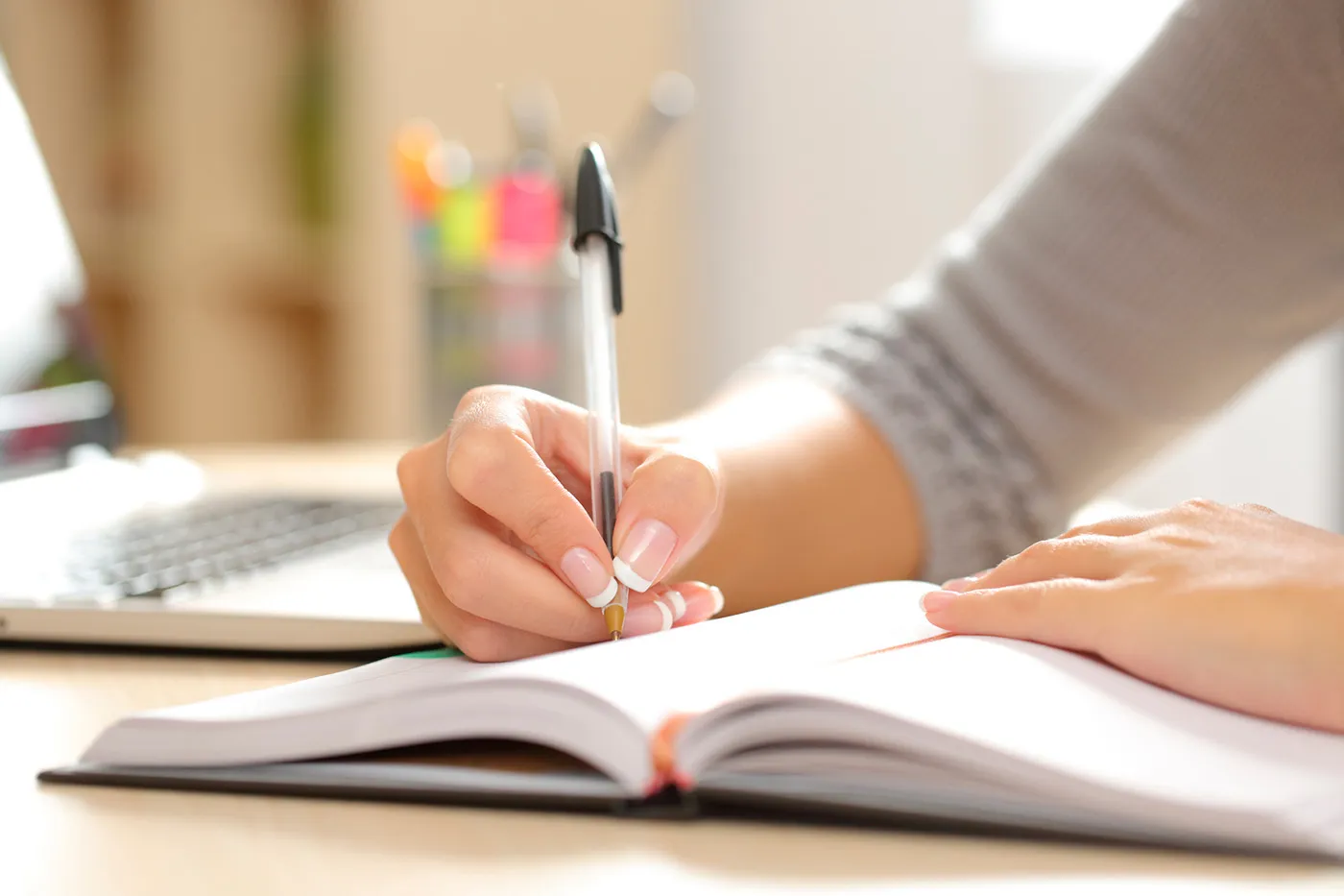 Woman writing student work